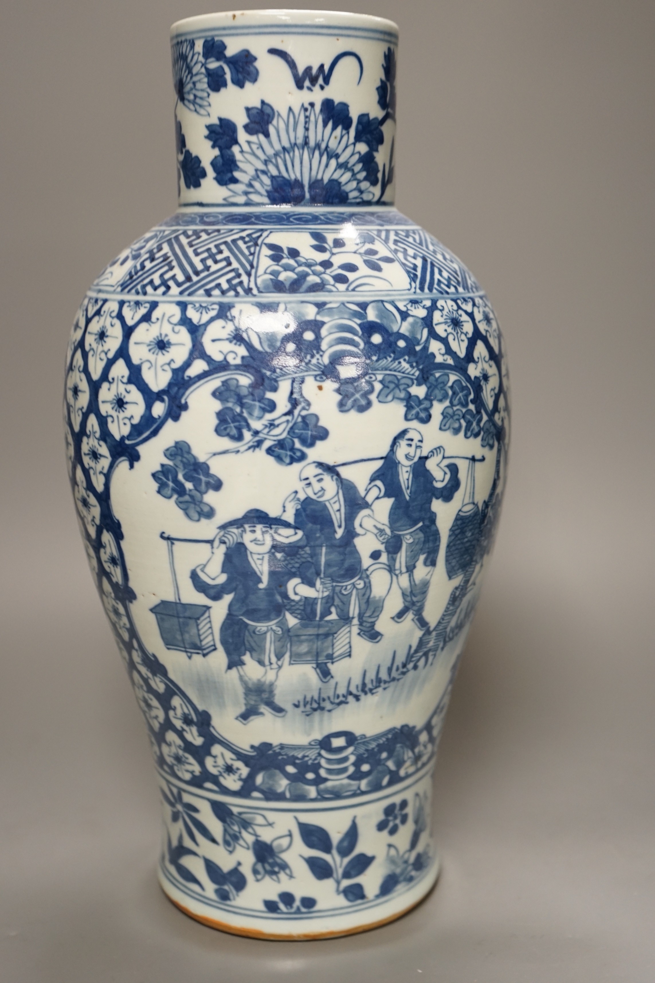 A 19th century Chinese blue and white 'Tradesmen' vase, 40cm